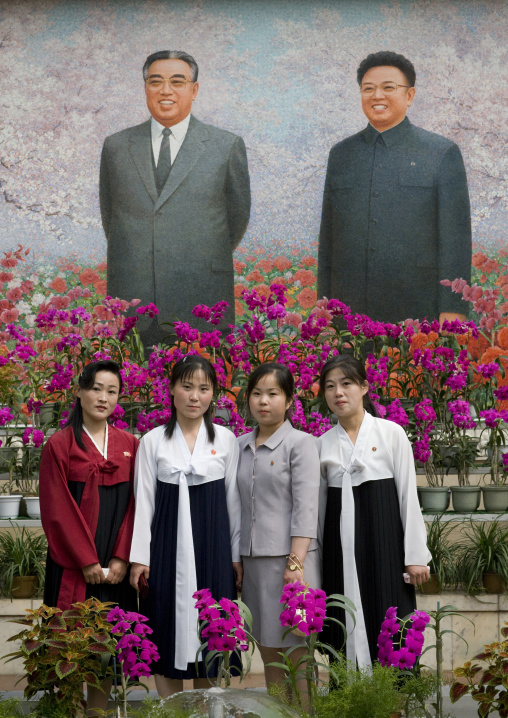 North Korean women posing in the international Kimilsungia and Kimjongilia festival, Pyongan Province, Pyongyang, North Korea