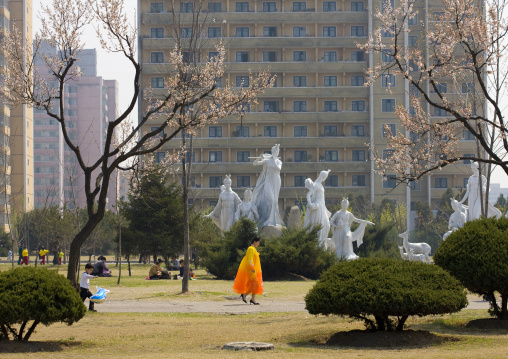North Korean woman in choson-ot walking in a park, Pyongan Province, Pyongyang, North Korea