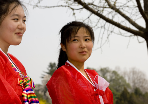 Two North Korean young women in choson-ot in a park, Pyongan Province, Pyongyang, North Korea