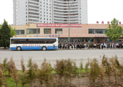 North Korean people queueing to take the bus, Pyongan Province, Pyongyang, North Korea