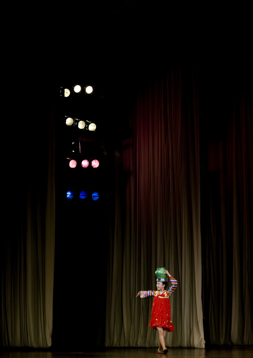 North Korean acrobat girl with a pottery on the stage of Mangyongdae children's palace, Pyongan Province, Pyongyang, North Korea