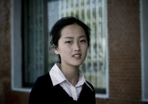 Portrait of a North Korean young woman in the street, Pyongan Province, Pyongyang, North Korea