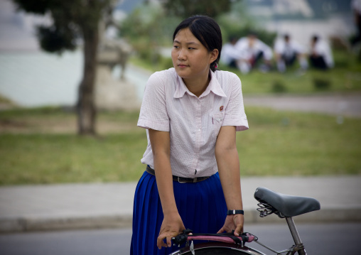 North Korean girl with her bicycle, Pyongan Province, Pyongyang, North Korea