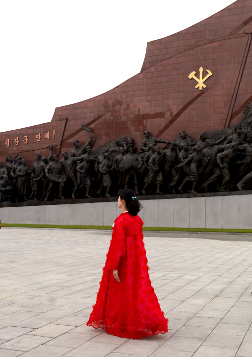 North Korean woman in red choson-ot in Mansudae Grand monument, Pyongan Province, Pyongyang, North Korea
