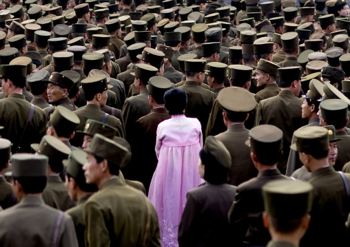 North Korean woman in pink choson-ot in the middle of soldiers, Pyongan Province, Pyongyang, North Korea