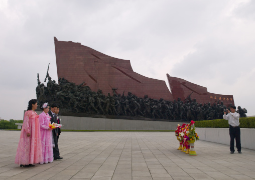 North Korean couples celebrating their weddings in front of Kim il Sung statue in Mansudae Grand monument, Pyongan Province, Pyongyang, North Korea