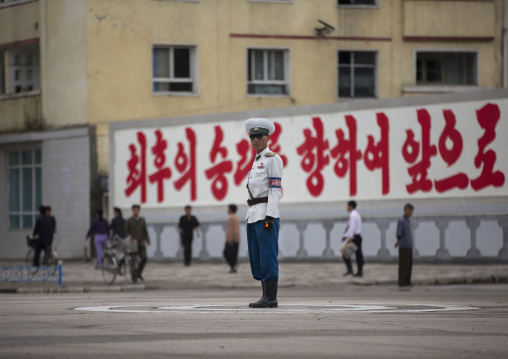 North Korean male traffic security officer in white uniform in the street, North Hwanghae Province, Kaesong, North Korea