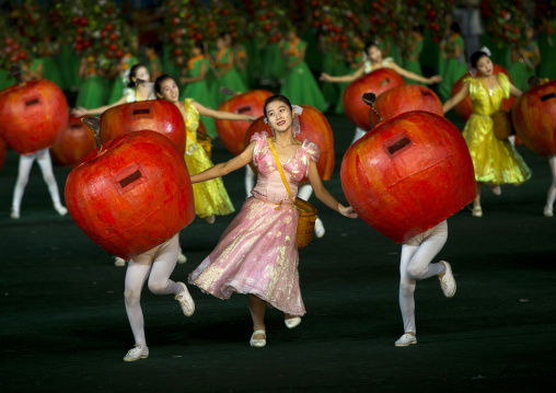 Women dancing between apples at Arirang mass games in may day stadium, Pyongan Province, Pyongyang, North Korea