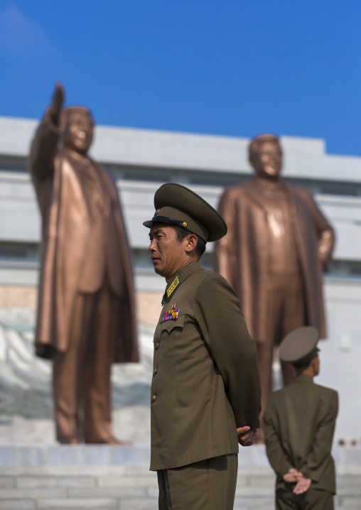 North Korean soldiers in front of the two statues of the Dear Leaders in the Grand monument on Mansu hill, Pyongan Province, Pyongyang, North Korea