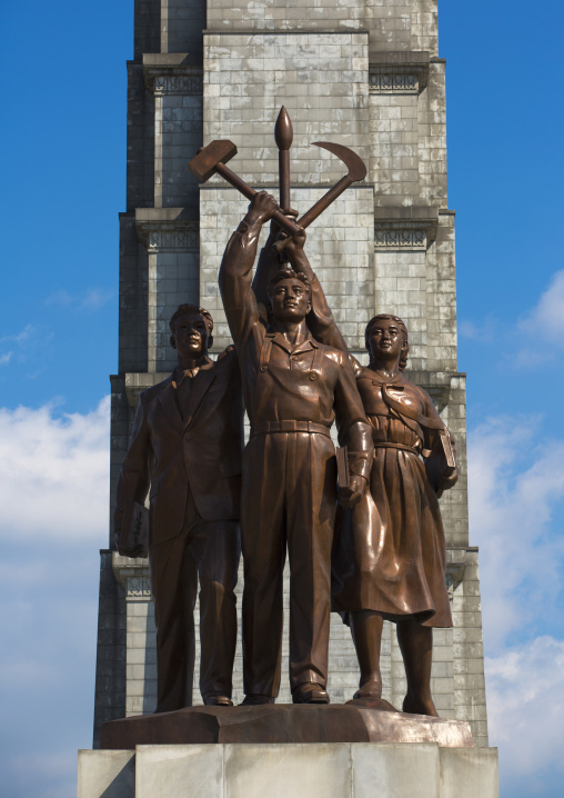 Bronze statues at the bottom of the Juche tower built to commemorate Kim il-sung's 70th birthday, Pyongan Province, Pyongyang, North Korea