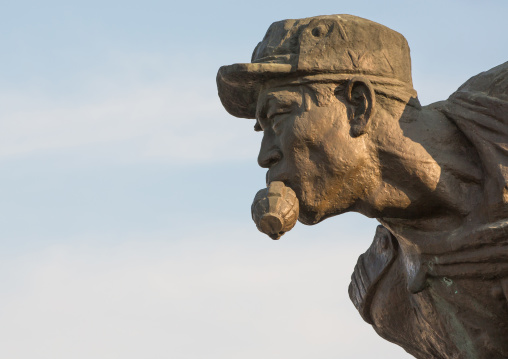Statue of a soldier with a grenade in the mouth at the entrance to the victorious fatherland liberation war museum, Pyongan Province, Pyongyang, North Korea