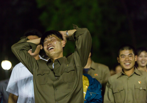 North Korean people laughing after a ride at Kaeson youth park fun fair, Pyongan Province, Pyongyang, North Korea