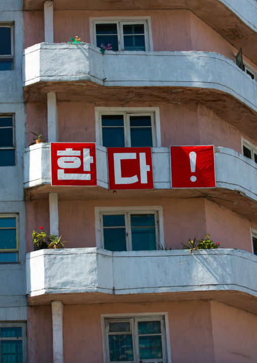 Propaganda slogan on old apartements in the city center, Kangwon Province, Wonsan, North Korea