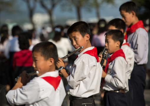 North Korean pioneers playing music in the street, Kangwon Province, Wonsan, North Korea