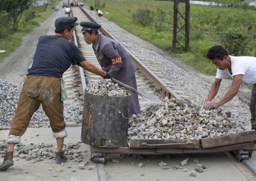 North Korean men working on empty railways, South Hamgyong Province, Hamhung, North Korea