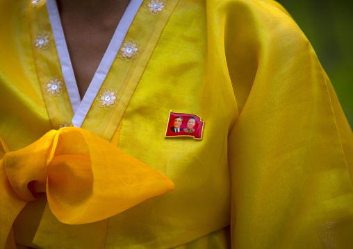 Close-up of the Dear Leaders badge on the traditional choson-ot of a North Korean woman, South Hamgyong Province, Hamhung, North Korea