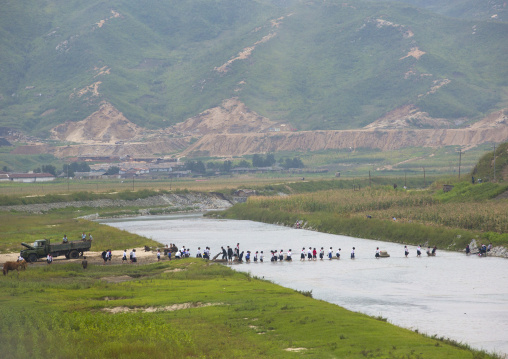 North Korean children crossing a river bare feet, South Hamgyong Province, Hamhung, North Korea