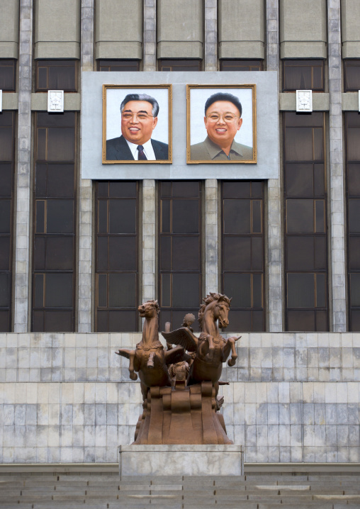 Kim il Sung and Kim Jong il giant portraits in front of Mangyongdae children's palace, Pyongan Province, Pyongyang, North Korea