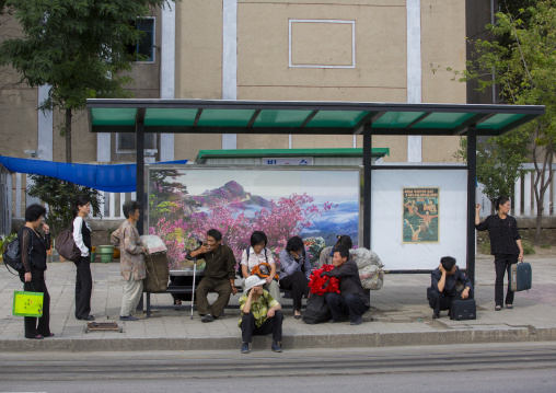 North Korean people waiting for a bus in the street, Pyongan Province, Pyongyang, North Korea