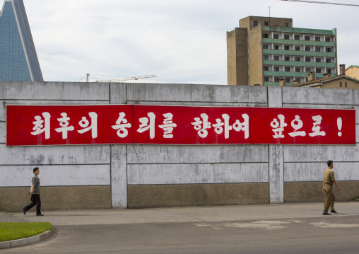Propaganda slogan on a red billboard in town, Pyongan Province, Pyongyang, North Korea
