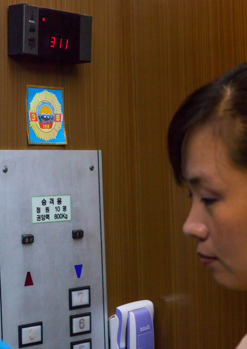 North Korean woman in an elevator which received an award in the Grand people's study house, Pyongan Province, Pyongyang, North Korea