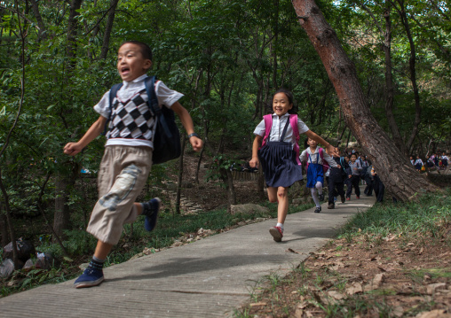 North Korean children running in a park, Pyongan Province, Pyongyang, North Korea