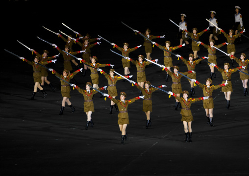 Sexy North Korean women dressed as soldiers dancing with swords during the Arirang mass games in may day stadium, Pyongan Province, Pyongyang, North Korea