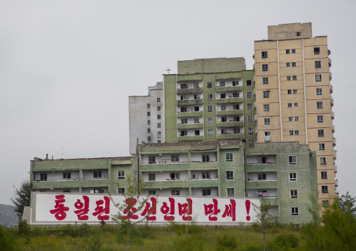 Buildings in a residential district with a propaganda billboard, North Hwanghae Province, Kaesong, North Korea