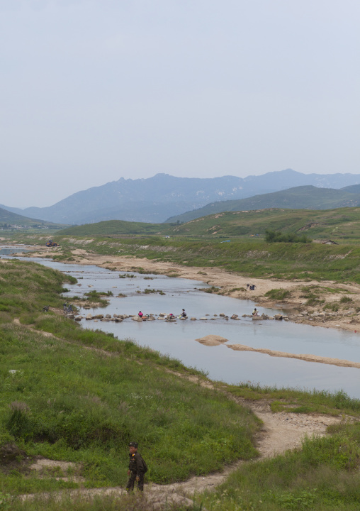 North Korean people washing clothes in a river, North Hwanghae Province, Kaesong, North Korea