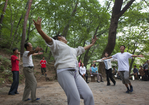 North Korean electricity company workers dancing in a park, North Hwanghae Province, Kaesong, North Korea