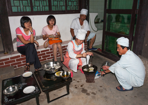 Cooks making traditional food in a restaurant, North Hwanghae Province, Kaesong, North Korea
