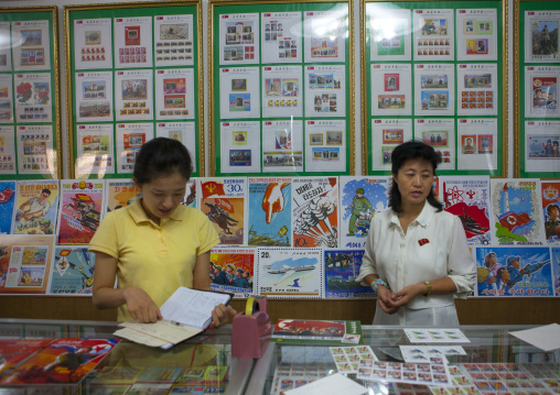 North Korean sellers in a stamps shop, North Hwanghae Province, Kaesong, North Korea