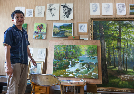 North Korean state artist in his workshop at Mansudae art studio, Pyongan Province, Pyongyang, North Korea