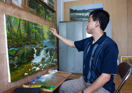North Korean state artist in his workshop at Mansudae art studio, Pyongan Province, Pyongyang, North Korea