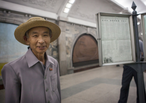 North Korean man reading the offical state newspaper in a metro station, Pyongan Province, Pyongyang, North Korea