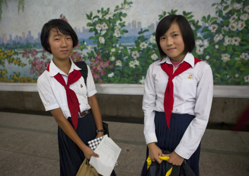 Two young pioneers girls in the subway, Pyongan Province, Pyongyang, North Korea