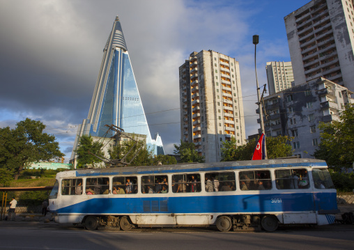 Tram passing in front of the pyramid-shape Ryugyong hotel, Pyongan Province, Pyongyang, North Korea