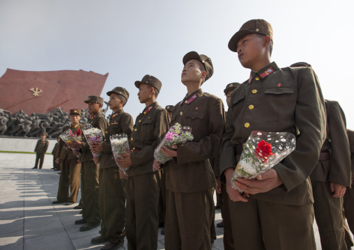 North Korean soldiers paying respect to the two statues of the Dear Leaders in the Grand monument on Mansu hill, Pyongan Province, Pyongyang, North Korea