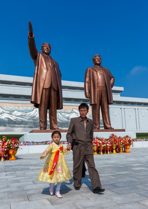 North Korean people in front of the statues of the Dear Leaders in Mansudae Grand monument, Pyongan Province, Pyongyang, North Korea
