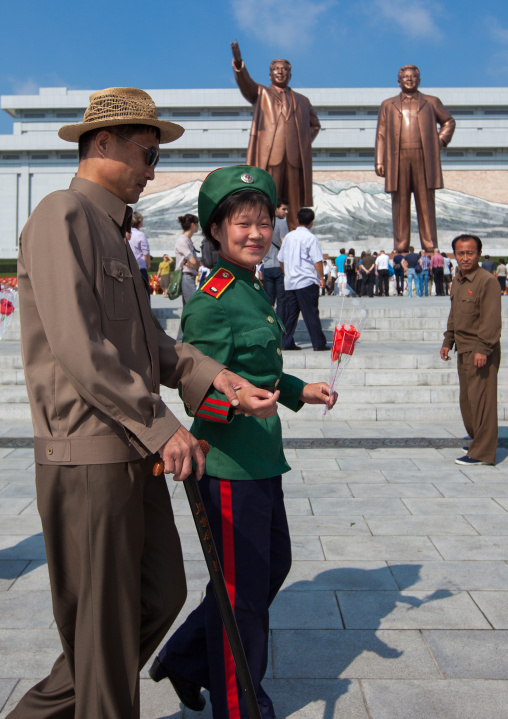 North Korean blind man in front of the statues of the Dear Leaders in Mansudae Grand monument, Pyongan Province, Pyongyang, North Korea