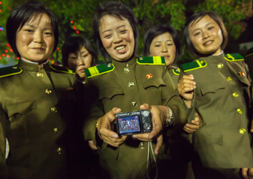 North Korean women soldiers showing a camera screen, Pyongan Province, Pyongyang, North Korea