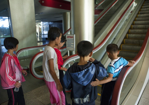 North Korean children from the countryside discovering an escalator in Songdowon international children's camp, Kangwon Province, Wonsan, North Korea