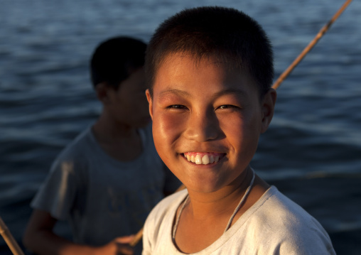 Portrait of a North Korean child boy fishing in the sea, Kangwon Province, Wonsan, North Korea