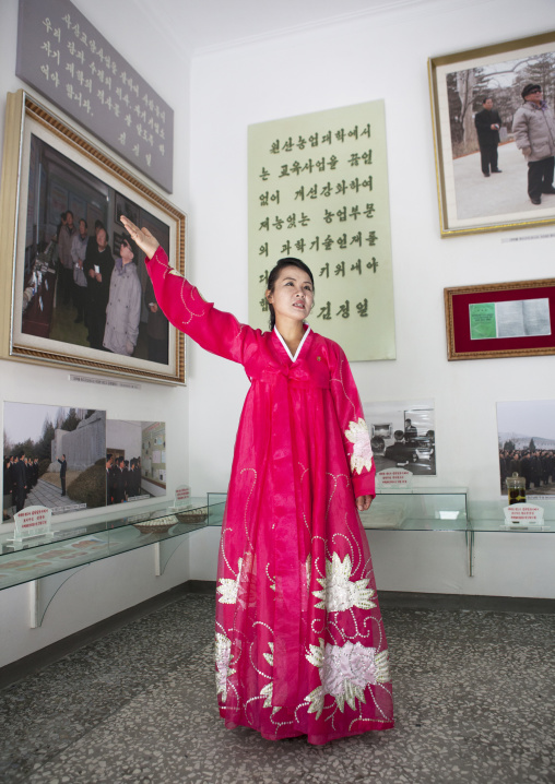 North Korean guide in red choson-ot dress in the agriculture university, South Hamgyong Province, Hamhung, North Korea