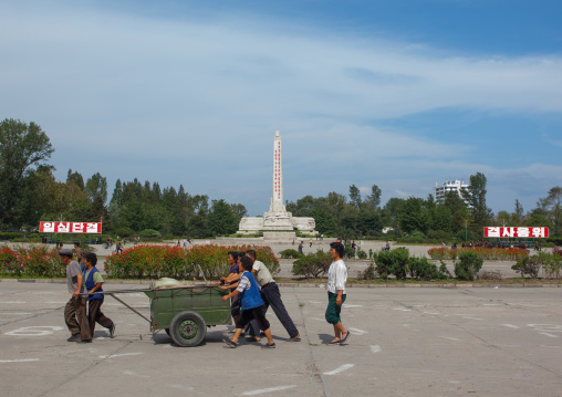 North Korean people pushing a heavy cart in the street, South Hamgyong Province, Hamhung, North Korea