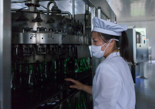 North Korean female worker in kangso yaksu mineral water factory, South Pyongan Province, Nampo, North Korea