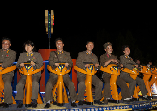North Korean soldiers in a fairground attraction at Kaeson youth park, Pyongan Province, Pyongyang, North Korea