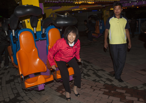 North Korean woman in a fairground attraction at Kaeson youth park, Pyongan Province, Pyongyang, North Korea