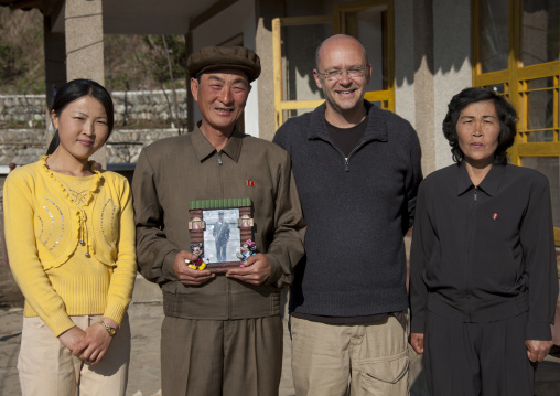French tourist with North Korean family in a homestay, North Hamgyong Province, Jung Pyong Ri, North Korea