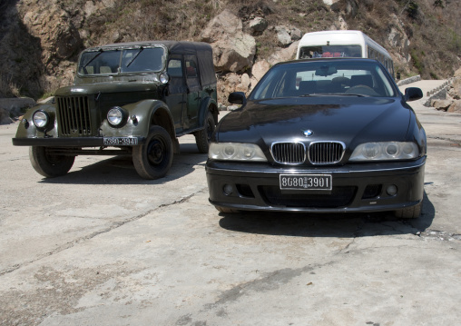 Bmw car parked near an old army jeep, North Hamgyong Province, Chilbo Sea, North Korea
